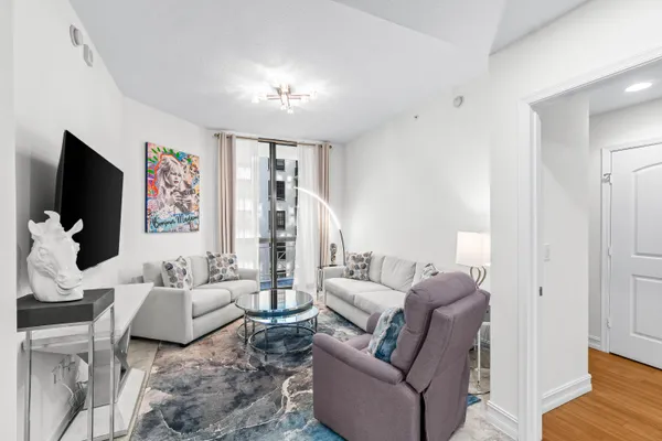 a living room with furniture and a flat screen tv
