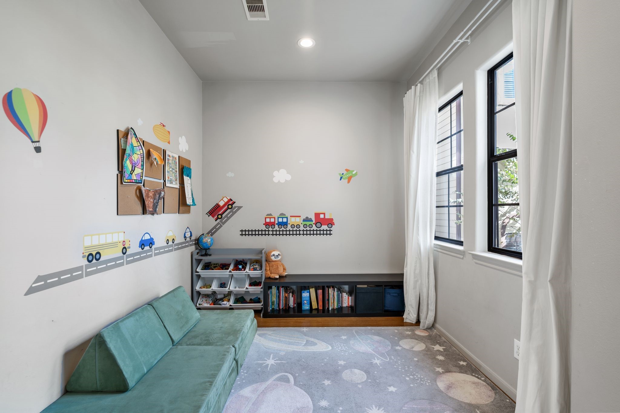 3934 Feagan Street Houston, TX 77007 - Photo 12 of 27 This flexible bonus space sits just off the kitchen through an arched entry, giving you extra room exactly where you need it most. It can easily function as a dining nook, playroom, home office, or an additional sitting area– perfect for a reading corner, homework station, or just a cozy spot to unwind. Currently had peel and stick decals for the playroom.