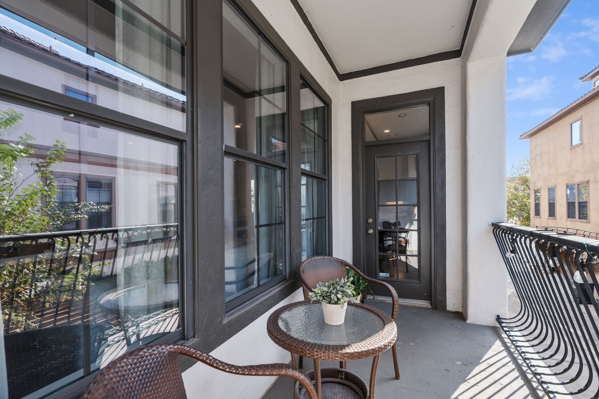 3934 Feagan Street Houston, TX 77007 - Photo 6 of 27 This balcony is located directly off of the family room giving you an easy extension of the living space for fresh air and a quick reset during the day. With room for a bistro set, it's the perfect spot for morning coffee, evening wine or a quiet place to unwind while still feeling connected to the heart of the home. The wrought iron railing and large windows add character and keep the space feeling open and airy.