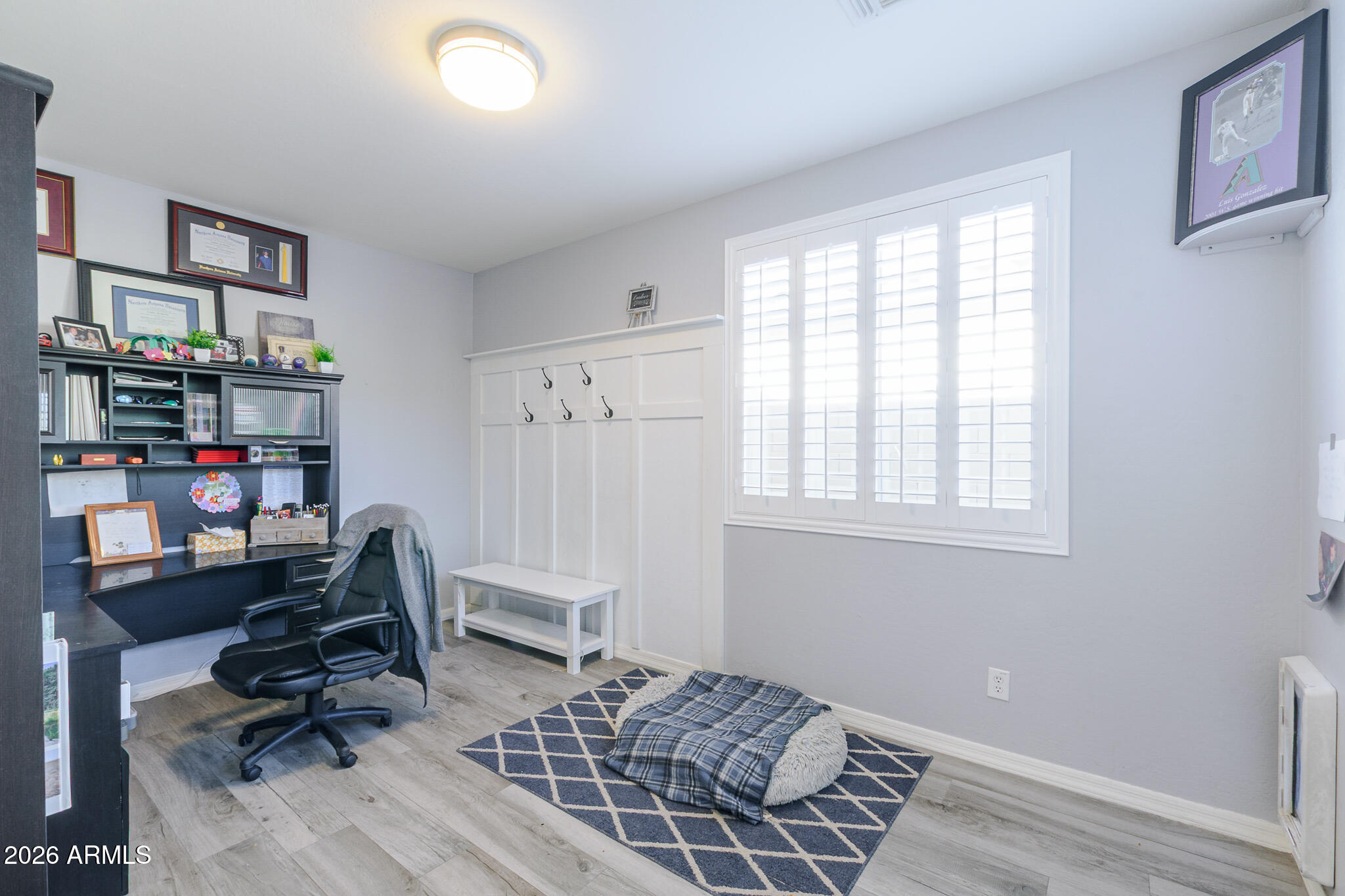4521 West Moss Springs Road Anthem, AZ 85086 - Photo 17 of 35 a view of a workspace with furniture and a window