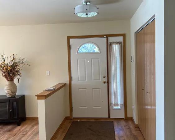 a view of an entryway with a dining room