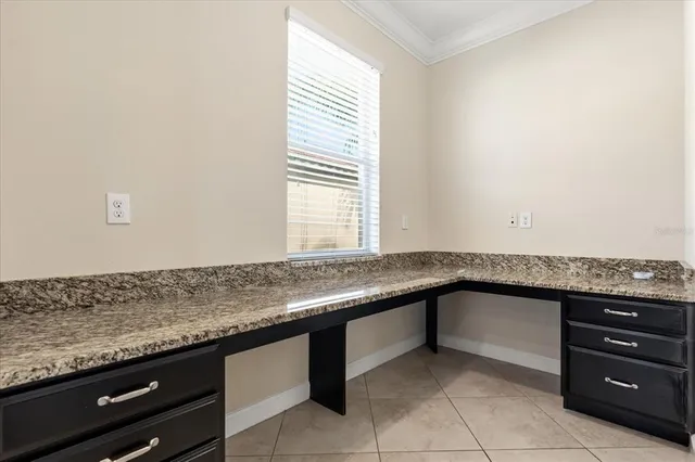 a kitchen with granite countertop a sink and a counter top space