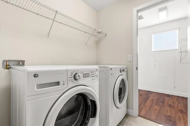 a utility room with dryer and washer