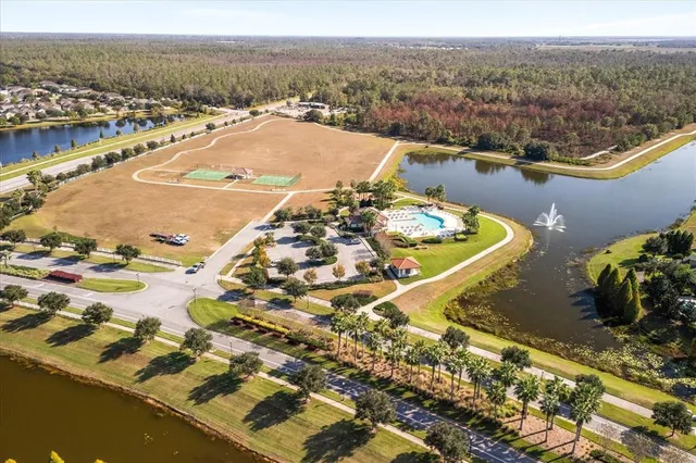 an aerial view of a house with swimming pool