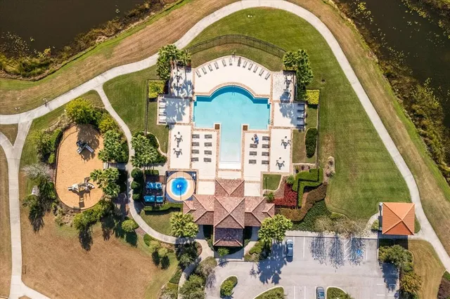 an aerial view of residential houses with outdoor space