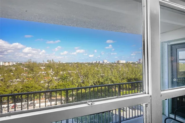 a bathroom with a granite countertop sink a mirror and a bathtub