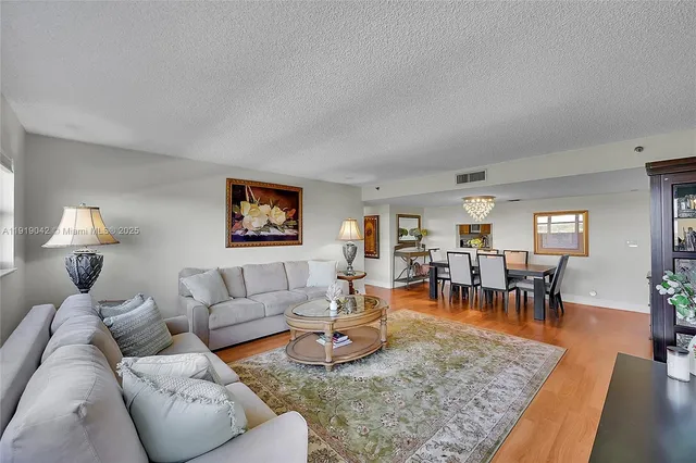 a kitchen with a sink stainless steel appliances and cabinets