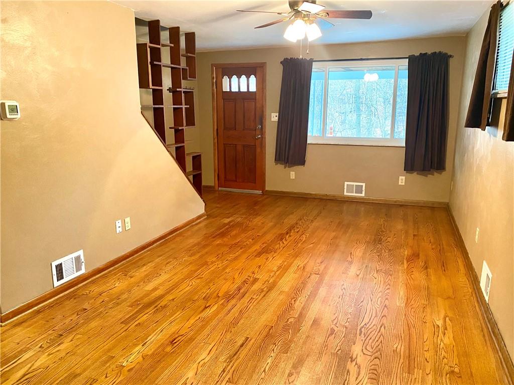 167 Fairfield Road Tarentum, PA 15084 - Photo 3 of 24 a view of a room with wooden floor and staircase
