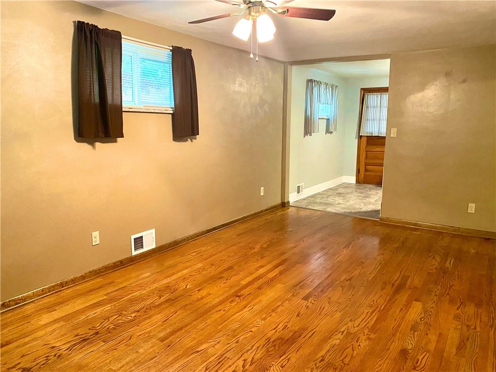 167 Fairfield Road Tarentum, PA 15084 - Photo 4 of 24 a view of a livingroom with wooden floor and a ceiling fan