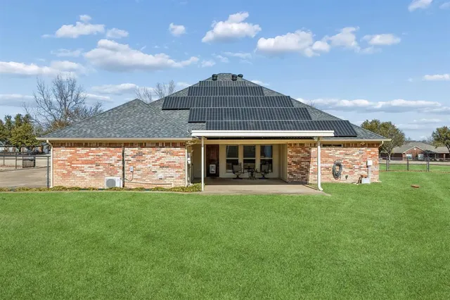 a view of a house with a garden