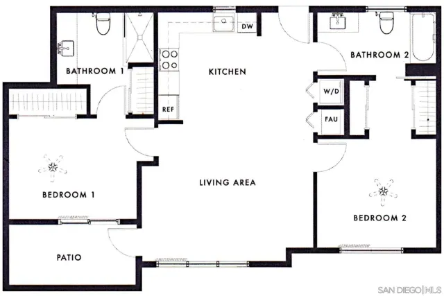 a kitchen that has a lot of cabinets in it and wooden floors