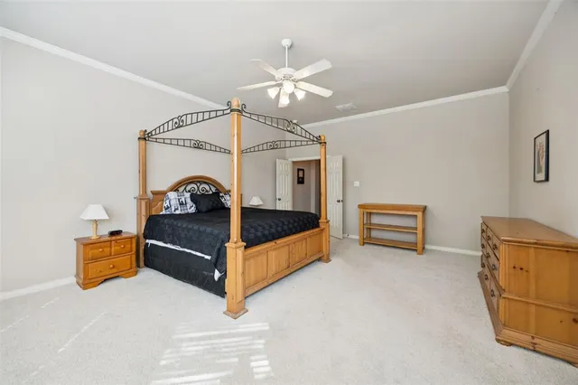 a bedroom with furniture and window