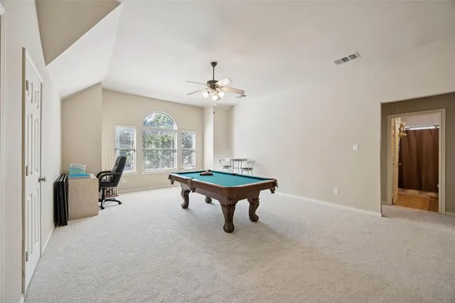 a living room with furniture a table and a chandelier