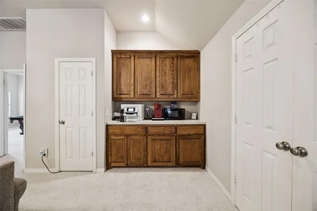 a view of a kitchen with cabinets