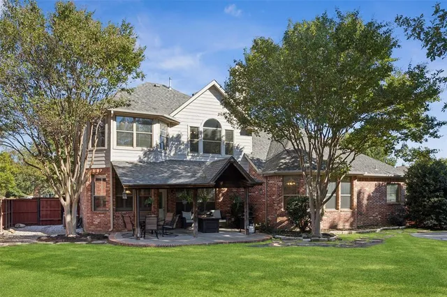 a view of a house with a yard porch and sitting area