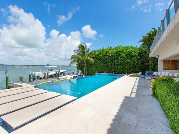 a view of a backyard with potted plants