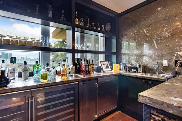 a kitchen with lots of counter top space and a sink