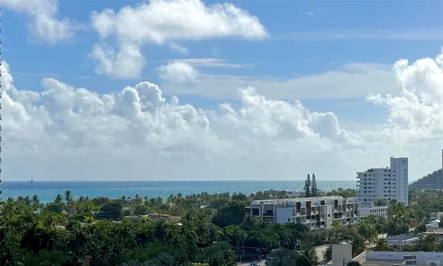 a view of a city with lots of green space