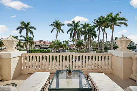 a view of a roof deck with wooden floor and outdoor seating