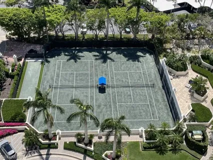 a room with gym equipment and large mirror