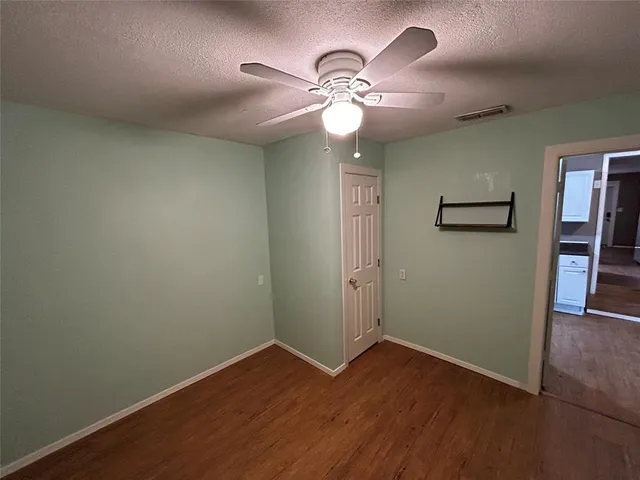 a view of a livingroom with wooden floor