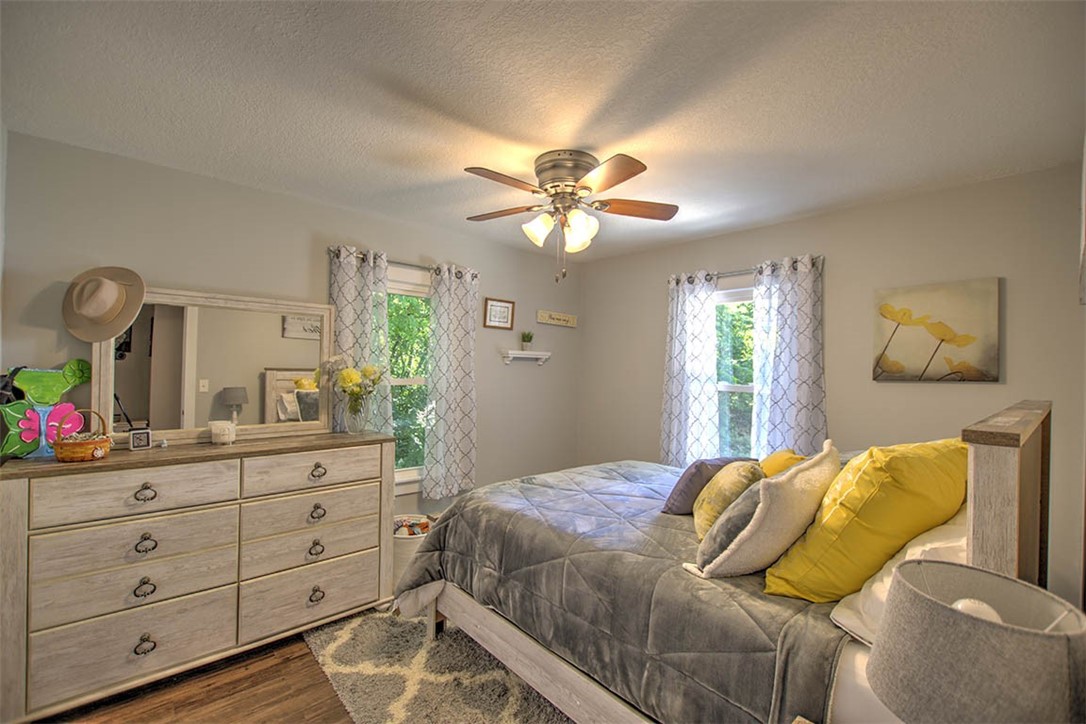 2925 East Main Street Decatur, IL 62521 - Photo 10 of 20 a bedroom with a bed and a chandelier