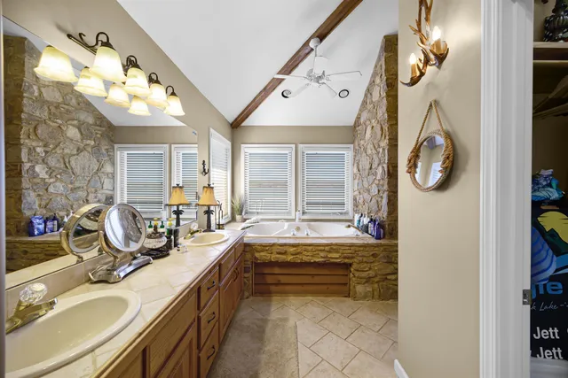 a spacious bedroom with a large bed and a large window