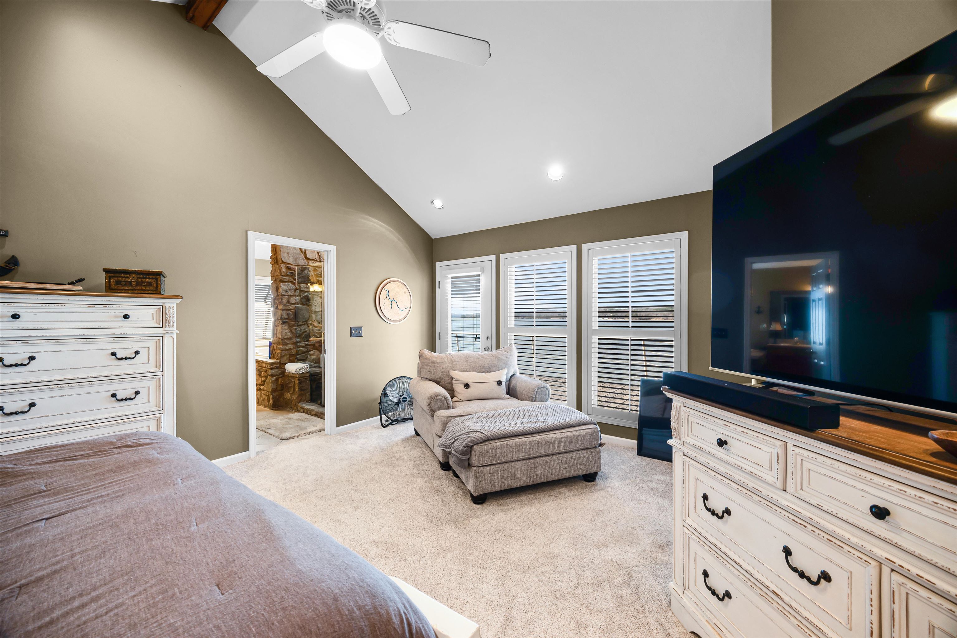 228 Chickasaw Trace Cherokee, AL 35616 - Photo 13 of 27 a spacious bedroom with a large bed and a large window