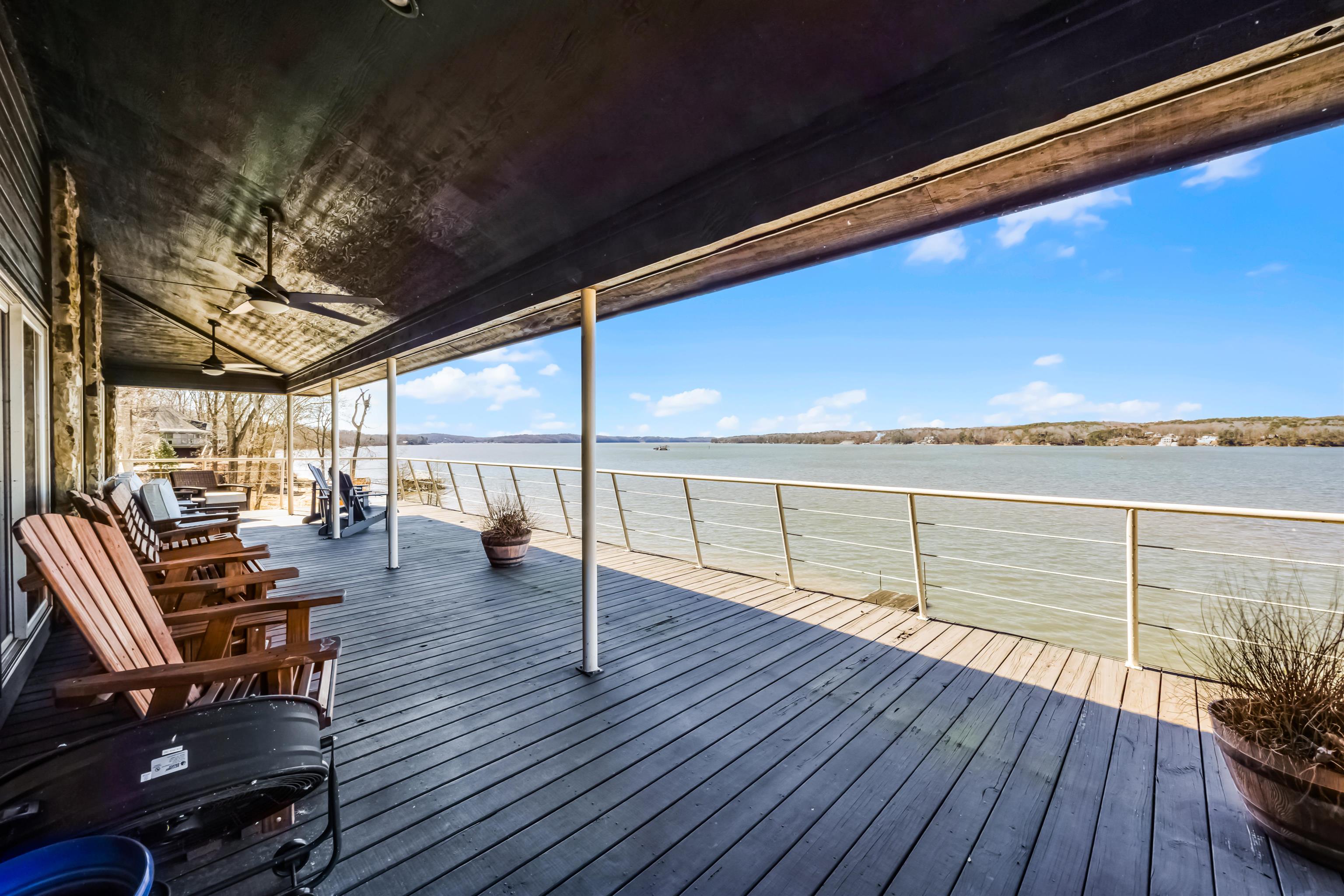 228 Chickasaw Trace Cherokee, AL 35616 - Photo 14 of 27 Wooden deck with a water view and a ceiling fan