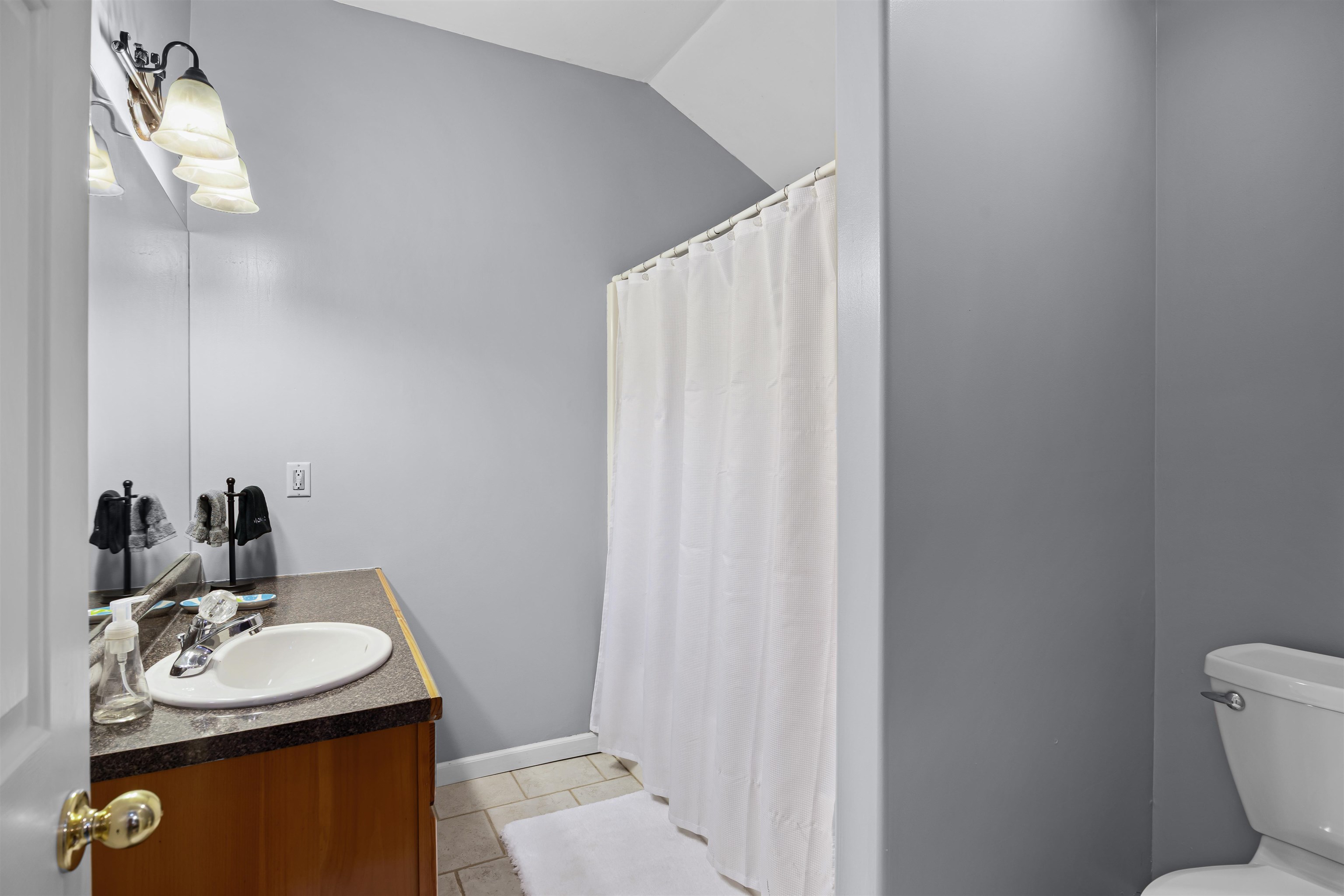 228 Chickasaw Trace Cherokee, AL 35616 - Photo 18 of 27 a bathroom with a sink toilet and vanity