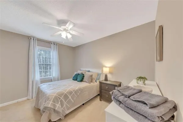 a bedroom with a bed furniture and a window