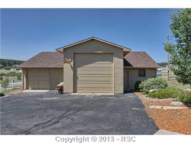 14575 Raton Road Colorado Springs, CO 80921 - Photo 17 of 25 This is the exterior of the Barn with separate Hay Door, and another storage shed to the side of the barn.