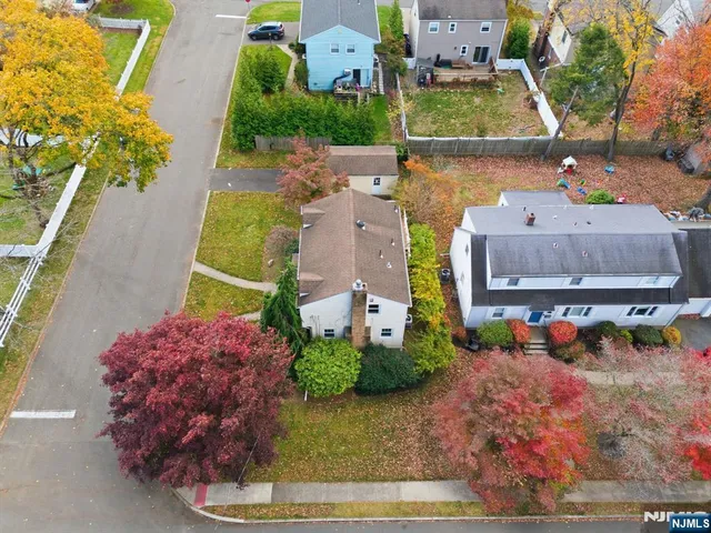 an aerial view of a house with a swimming pool