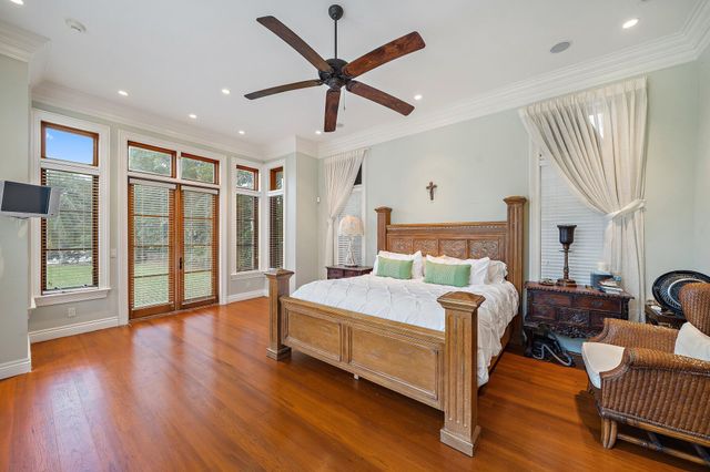 a spacious bathroom with a tub sink and mirror