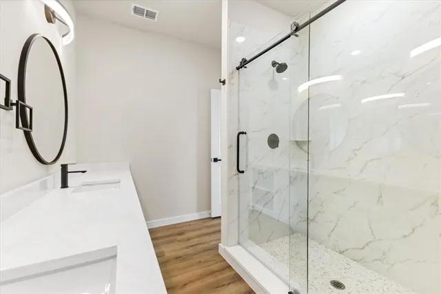a bathroom with a sink and a mirror