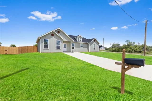 a house view with a garden space