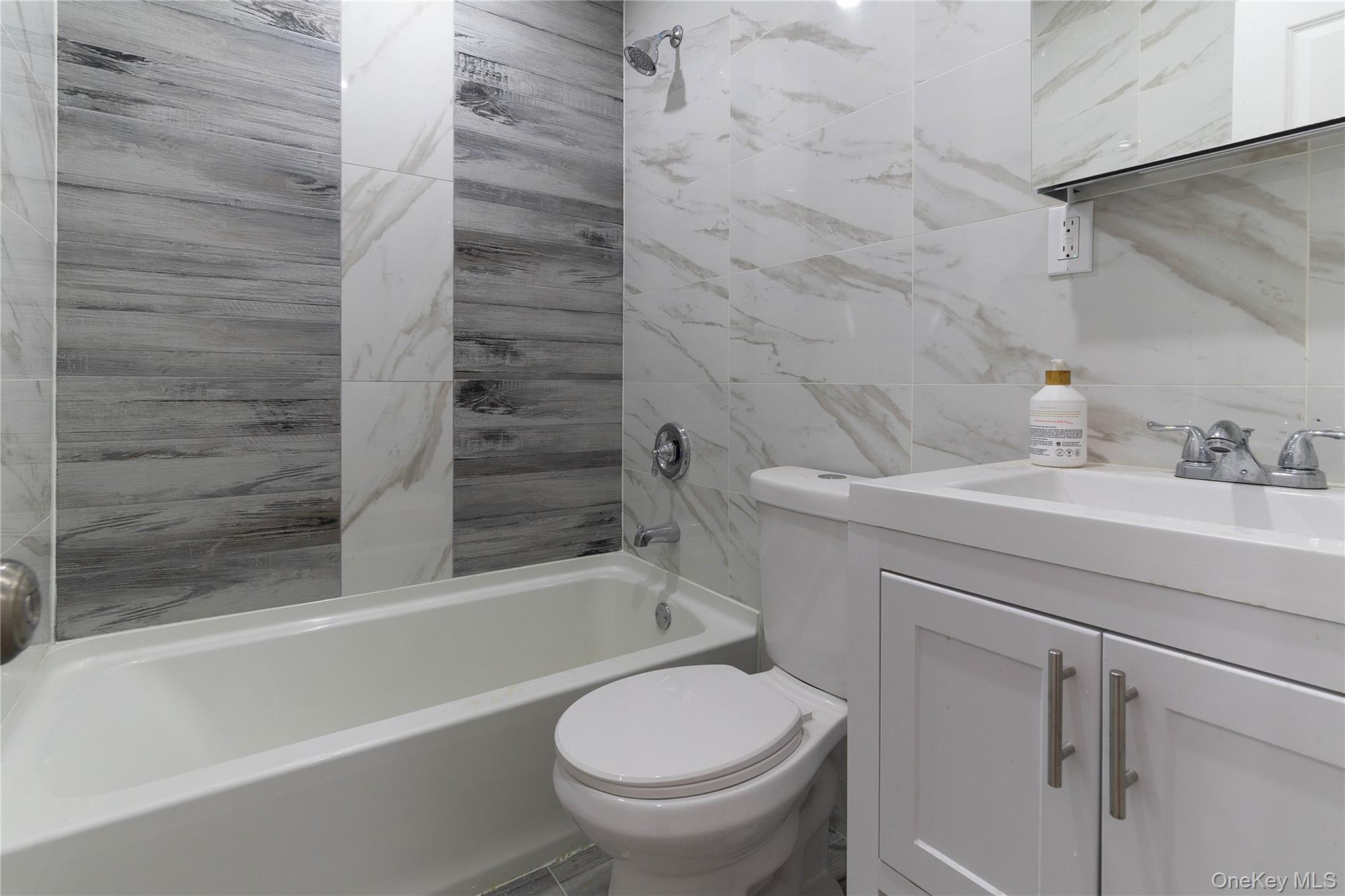 2-15 Beach 96th Street Queens, NY 11693 - Photo 14 of 39 a bathroom with a sink a toilet and shower