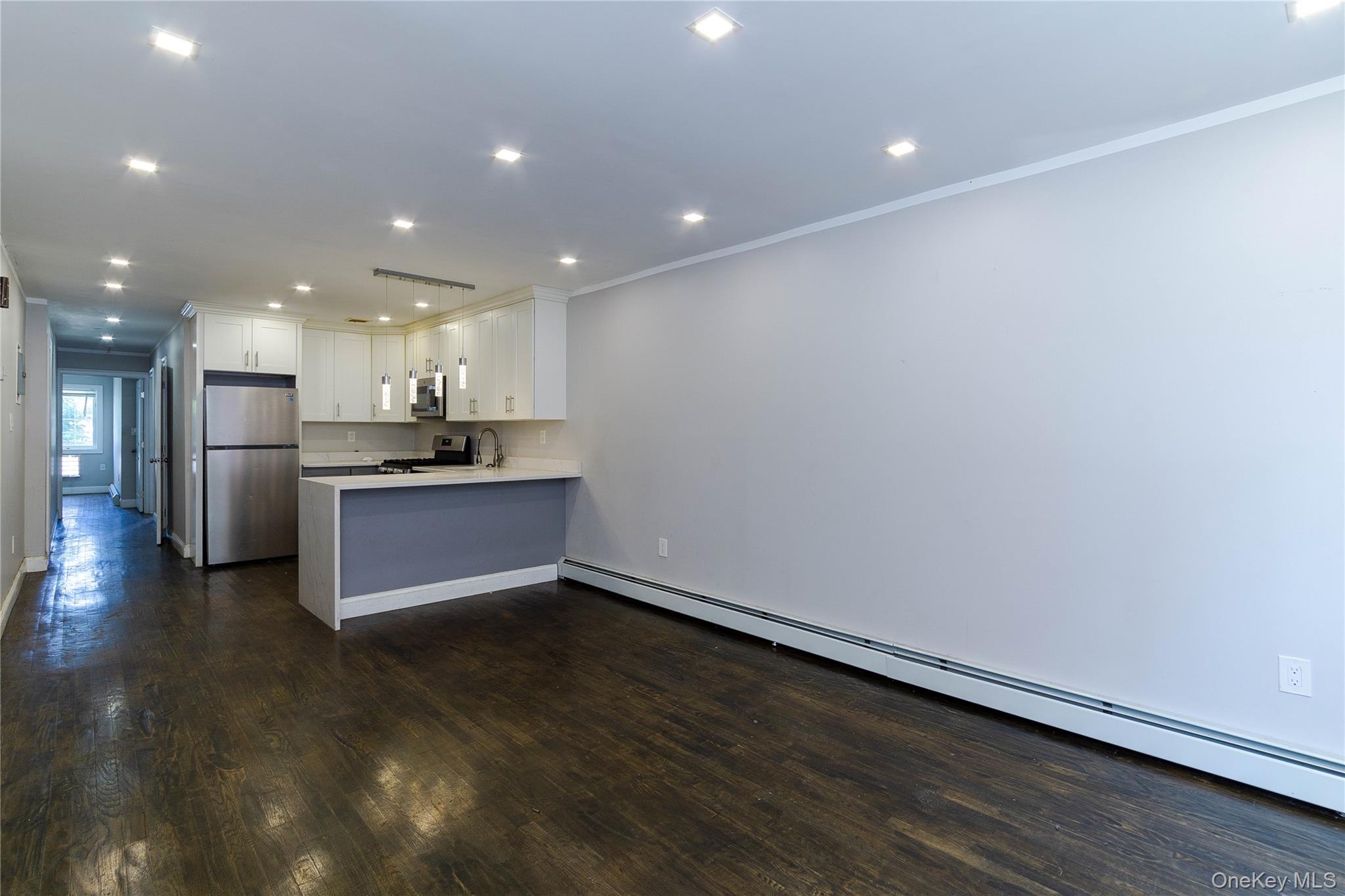 2-15 Beach 96th Street Queens, NY 11693 - Photo 16 of 39 a view of kitchen with refrigerator and window