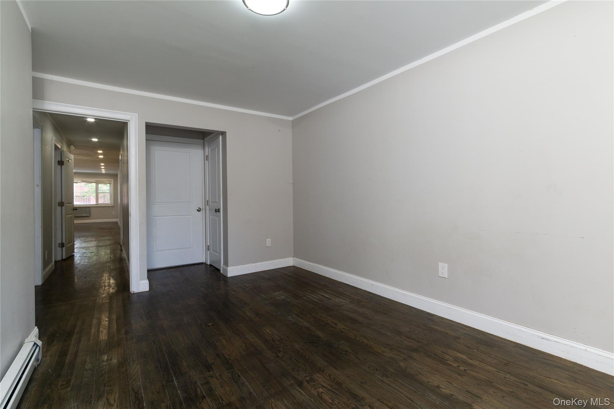 2-15 Beach 96th Street Queens, NY 11693 - Photo 22 of 39 wooden floor in an empty room