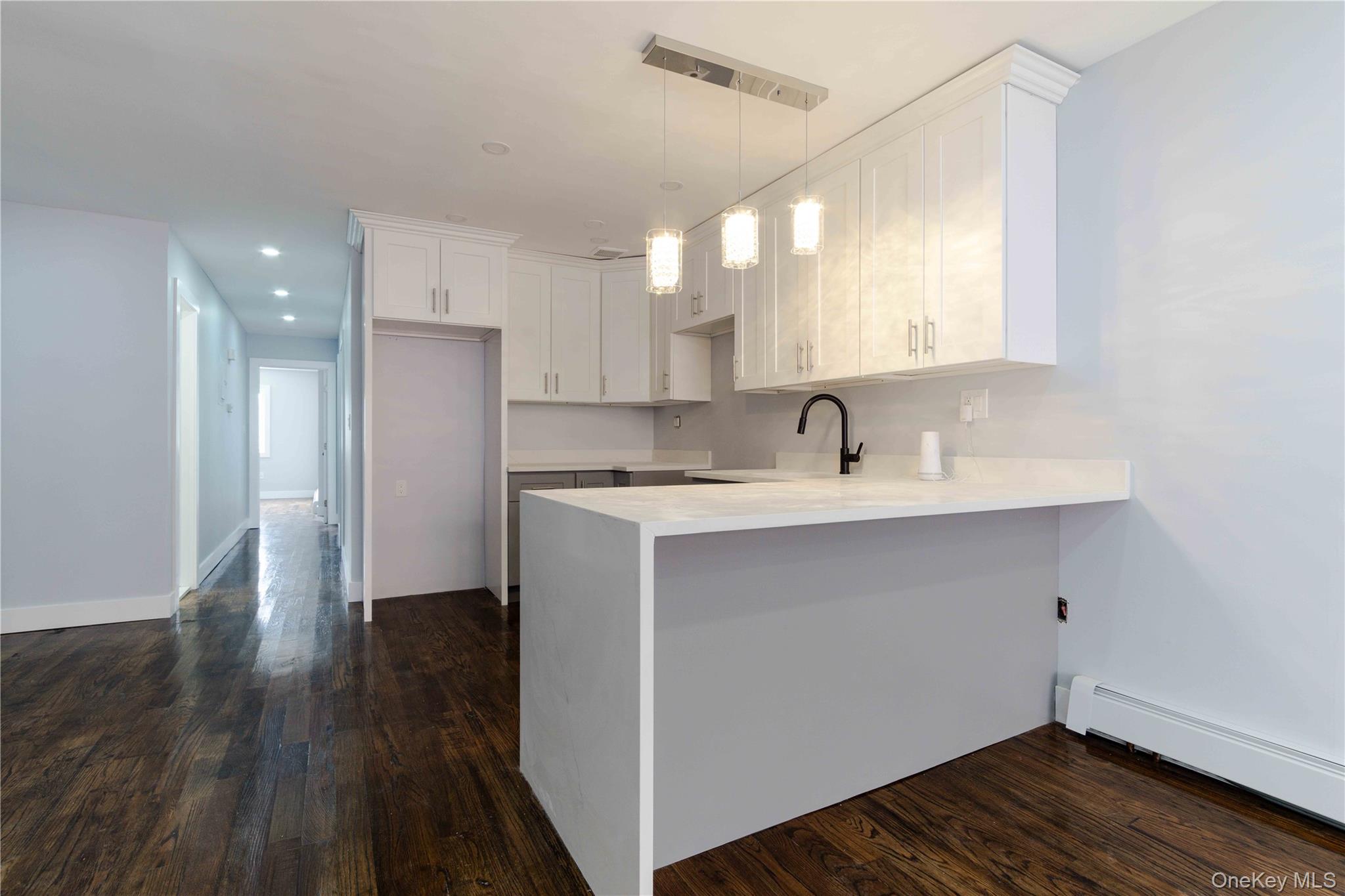 2-15 Beach 96th Street Queens, NY 11693 - Photo 27 of 39 a view of a sink and a refrigerator in a room