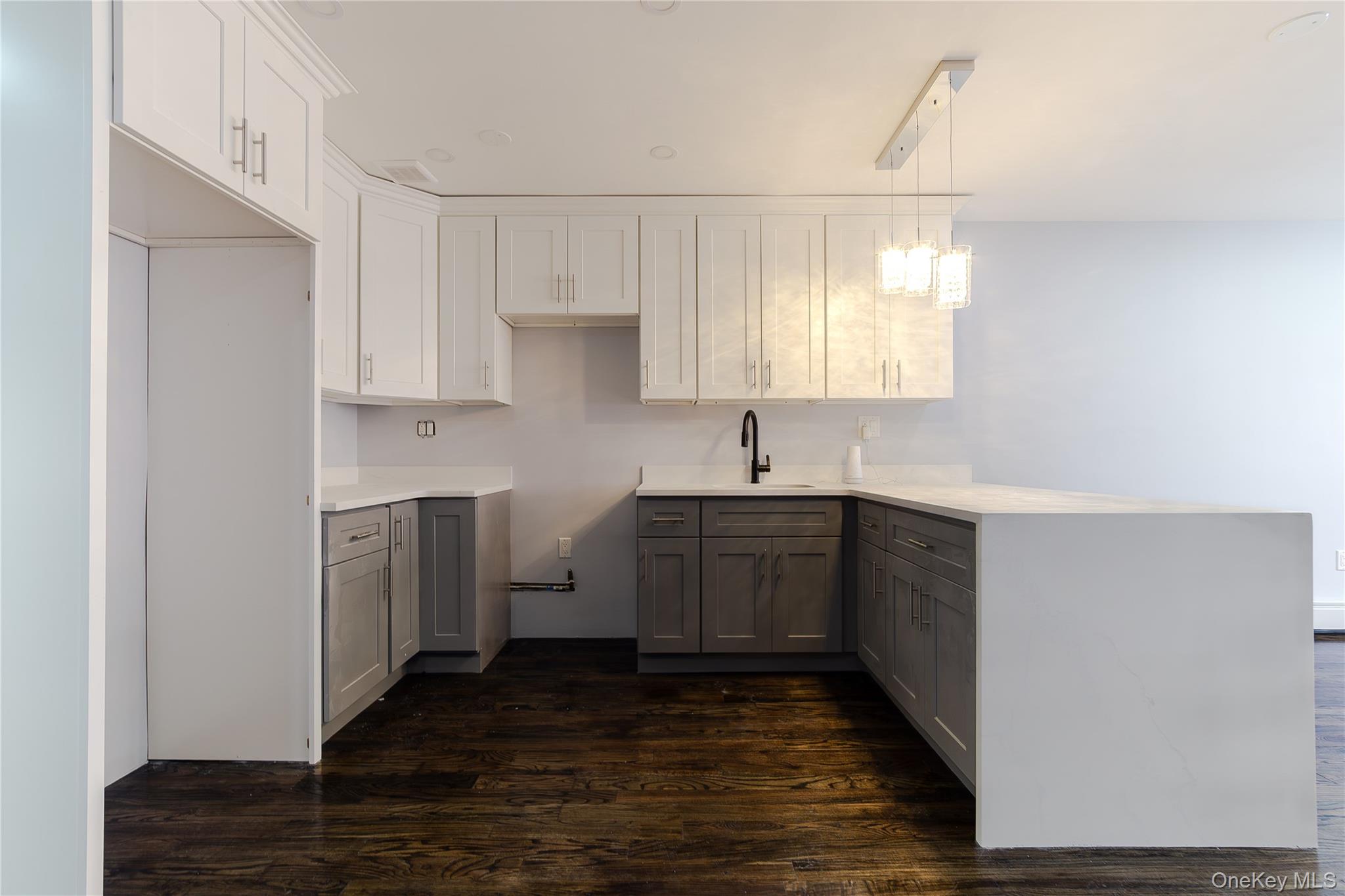 2-15 Beach 96th Street Queens, NY 11693 - Photo 29 of 39 a kitchen with sink cabinets and window