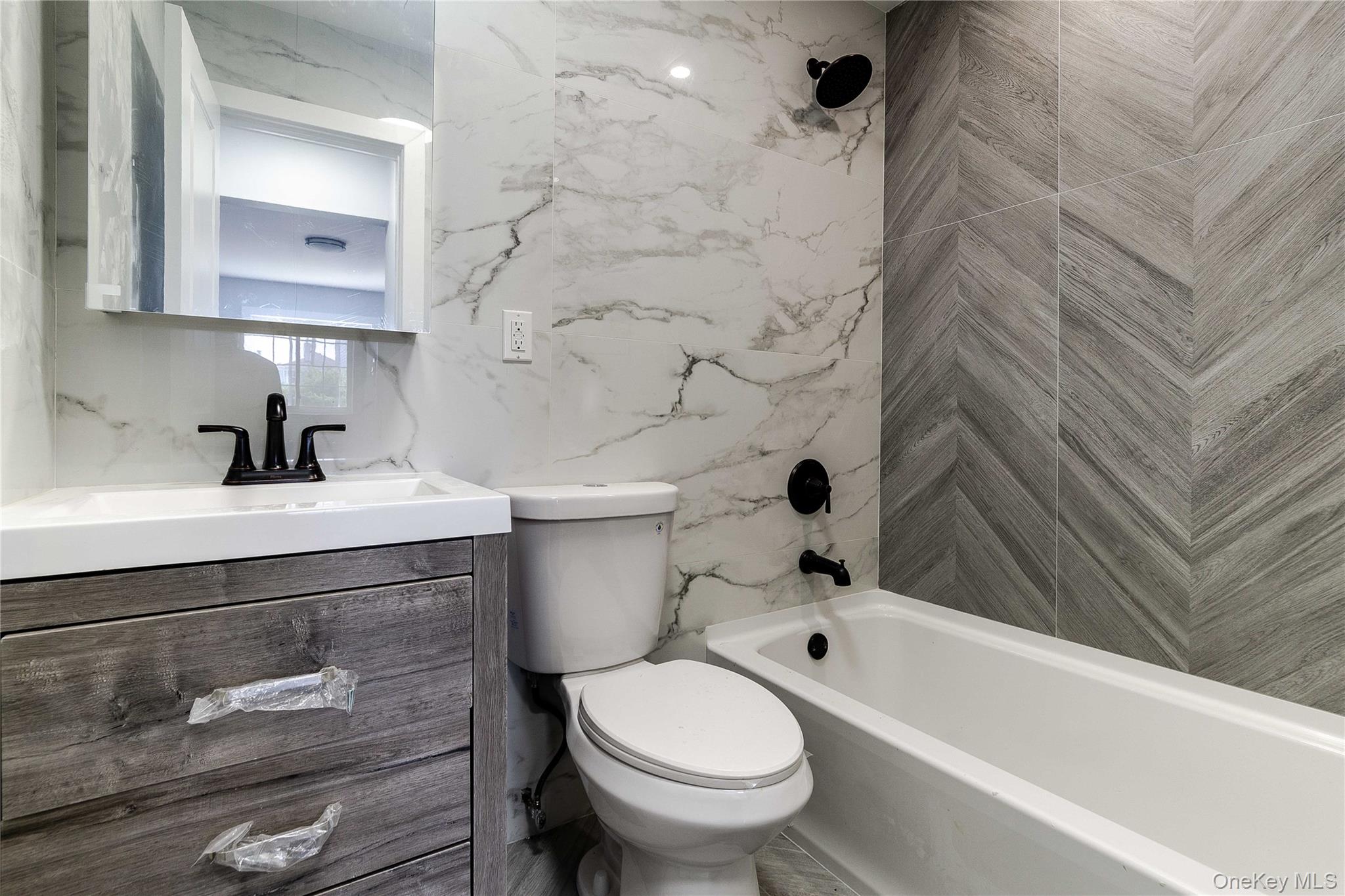 2-15 Beach 96th Street Queens, NY 11693 - Photo 32 of 39 a bathroom with a sink toilet and shower