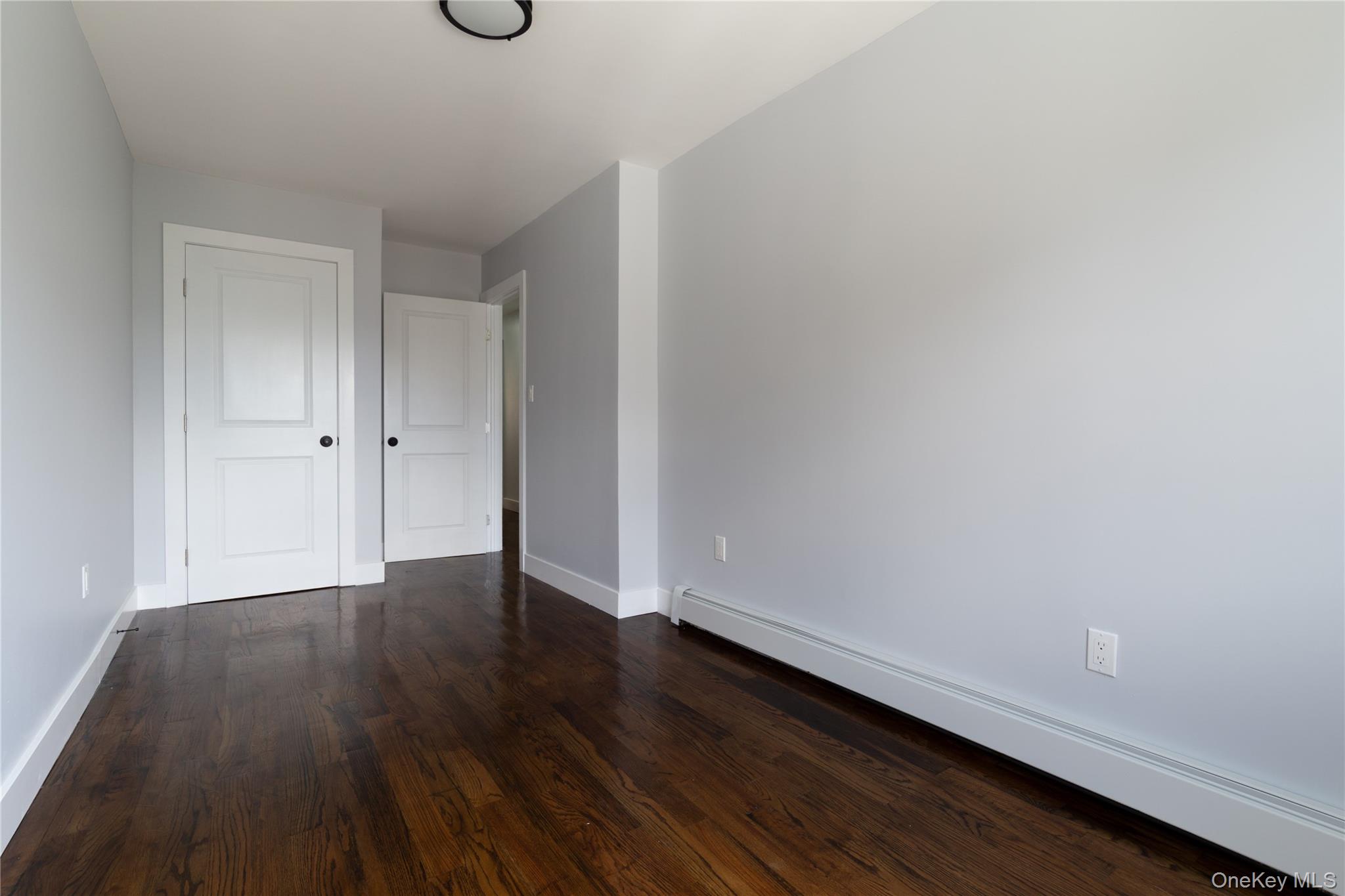 2-15 Beach 96th Street Queens, NY 11693 - Photo 35 of 39 a view of an empty room and wooden floor