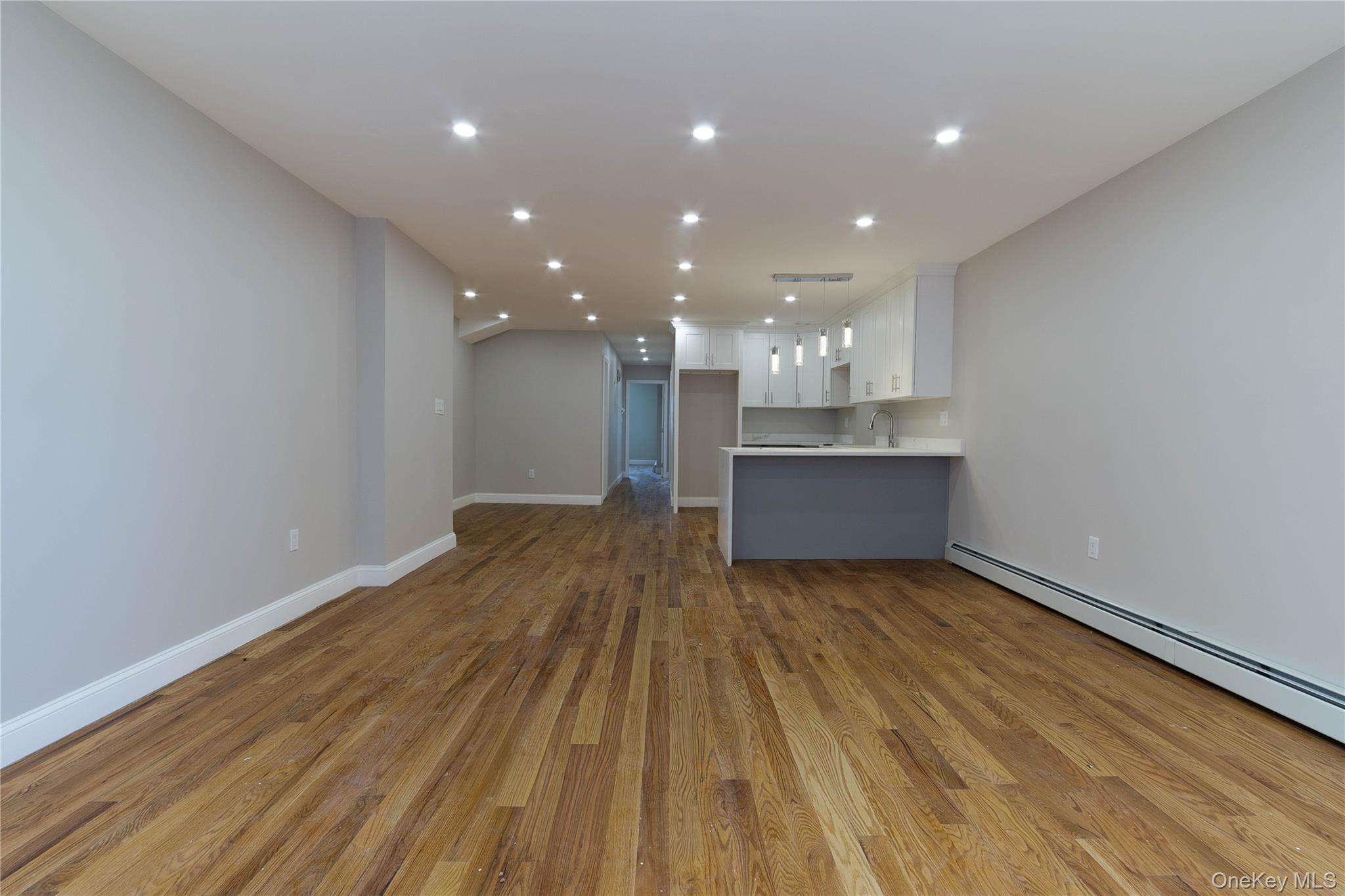 2-15 Beach 96th Street Queens, NY 11693 - Photo 5 of 39 a view of a room with wooden floor and kitchen