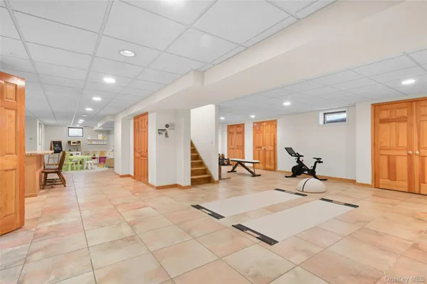 a room with gym equipment and view of living room