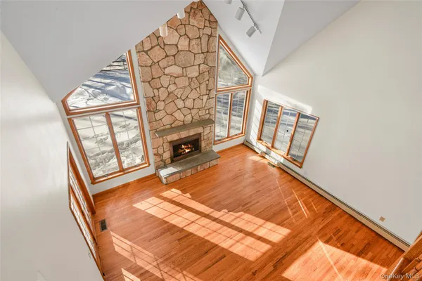a living room with a bed furniture and a fireplace