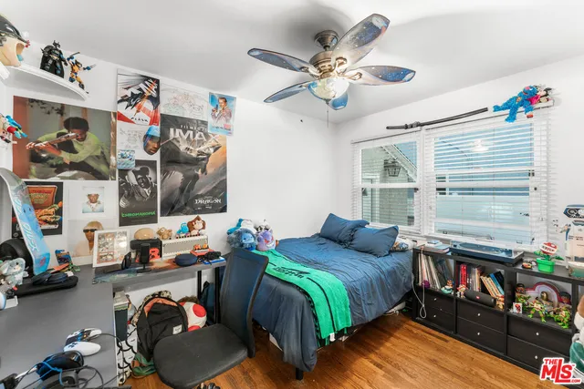 a bed room with a bed and a window