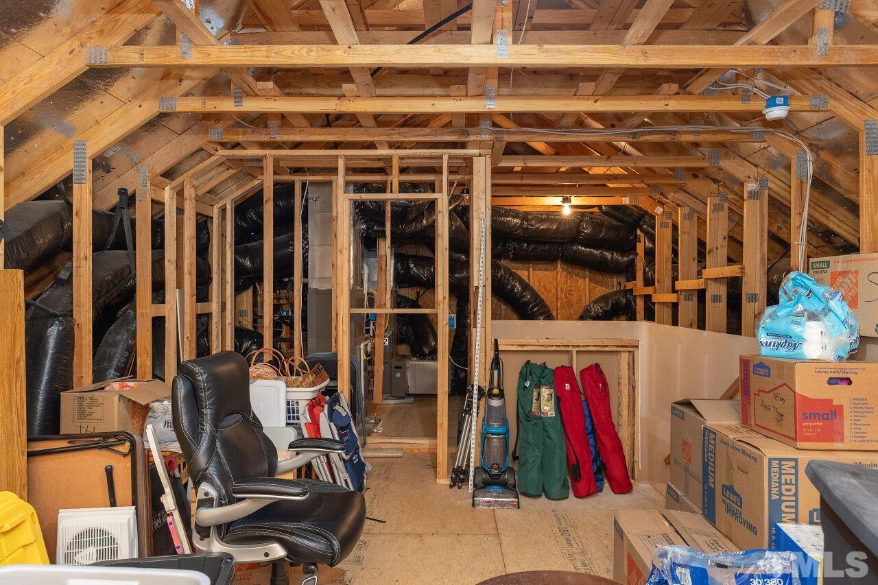 842 Wickham Ridge Road Apex, NC 27539 - Photo 35 of 43 a view of walk in closet with clothes and shoes