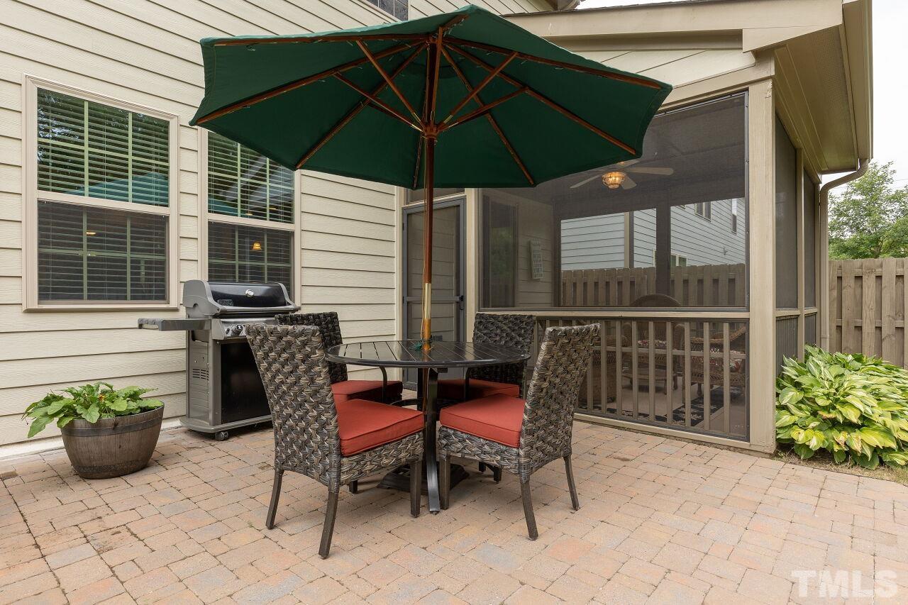 842 Wickham Ridge Road Apex, NC 27539 - Photo 37 of 43 a view of a chairs and table in the back yard