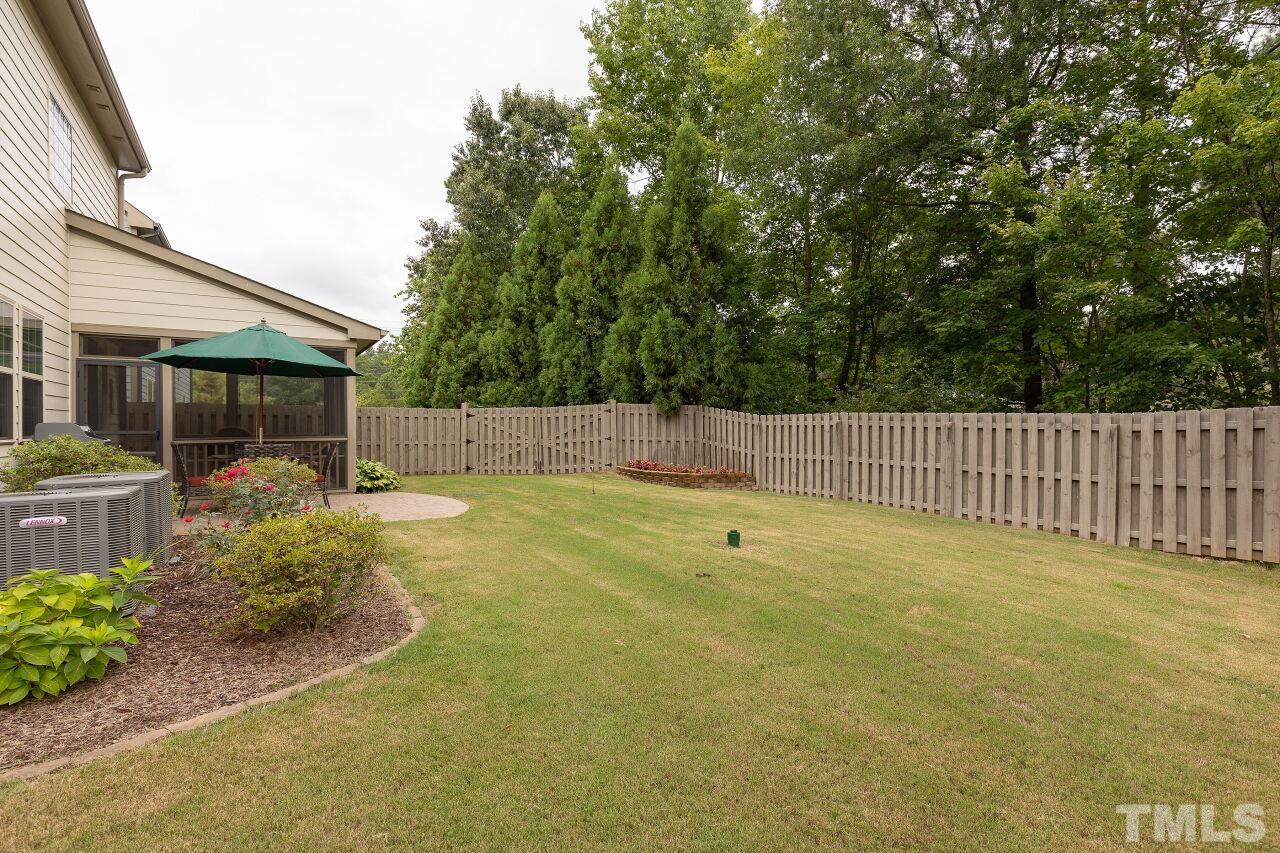 842 Wickham Ridge Road Apex, NC 27539 - Photo 38 of 43 a view of backyard and house